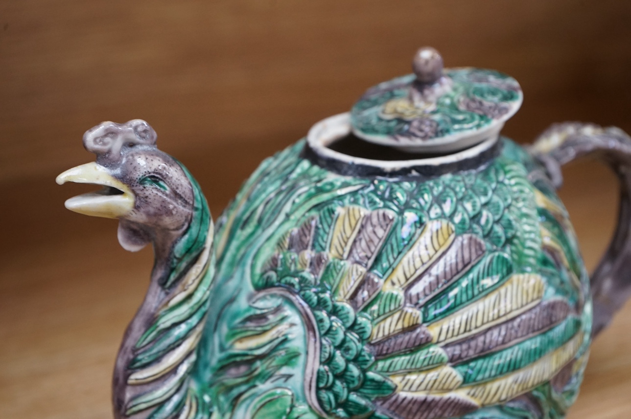 A Chinese susancai teapot in the form of a phoenix, Qianlong mark but 19th century, 15cm high. Condition - fair, repair to handle.